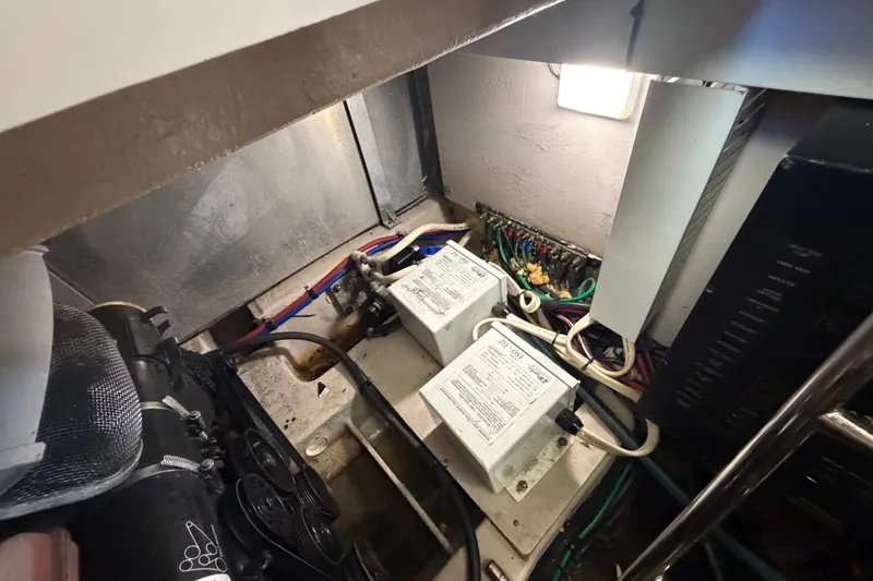Slide: The Image of Engine room of 2010 Sea Ray 390 Sedan Bridge with electrical components and wiring. - 141
