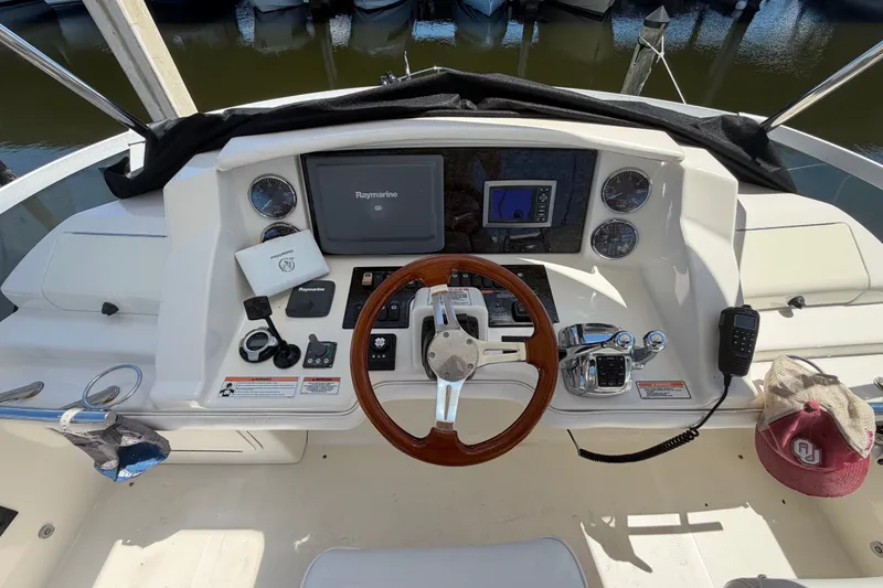 Slide: The Image of Helm of 2010 Sea Ray 390 Sedan Bridge with navigation equipment and controls. - 38