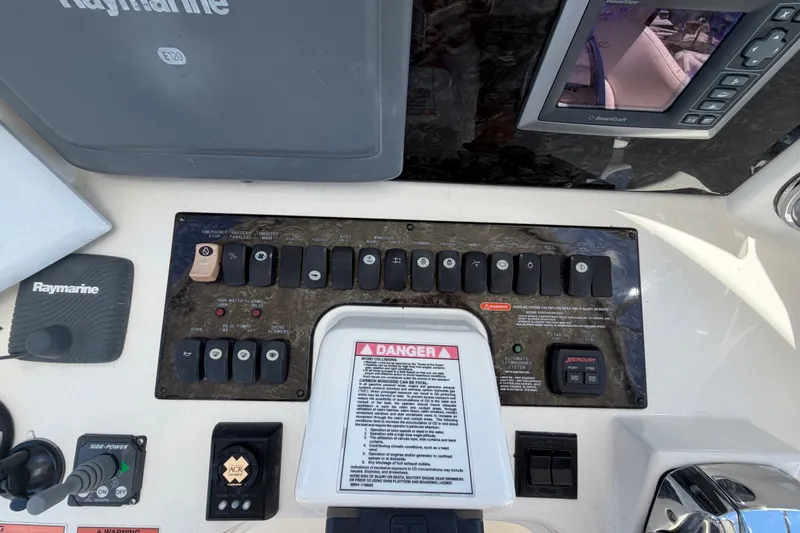 Slide: The Image of Control panel of a 2010 Sea Ray 390 Sedan Bridge with Raymarine equipment. - 40