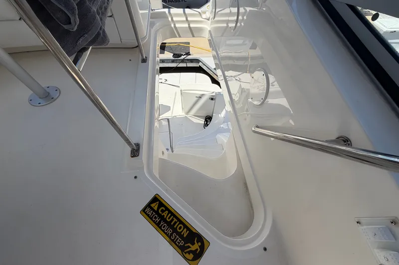 Slide: The Image of Stairway on 2010 Sea Ray 390 Sedan Bridge with caution sign and railing. - 47