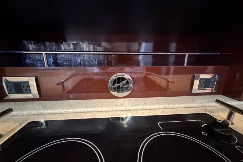 Slide: The Image of Modern kitchen area in a 2010 Sea Ray 390 Sedan Bridge yacht. - 76
