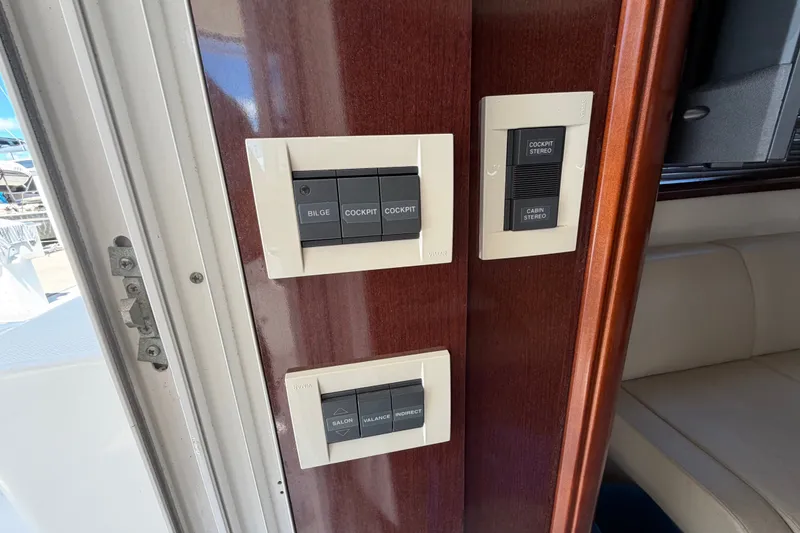 Slide: The Image of Control panel on 2010 Sea Ray 390 Sedan Bridge yacht interior. - 89