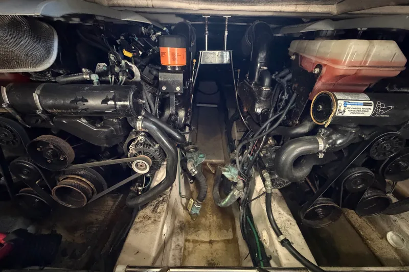 Slide: The Image of Engine compartment of a 2010 Sea Ray 390 Sedan Bridge boat, showcasing mechanical components. - 133