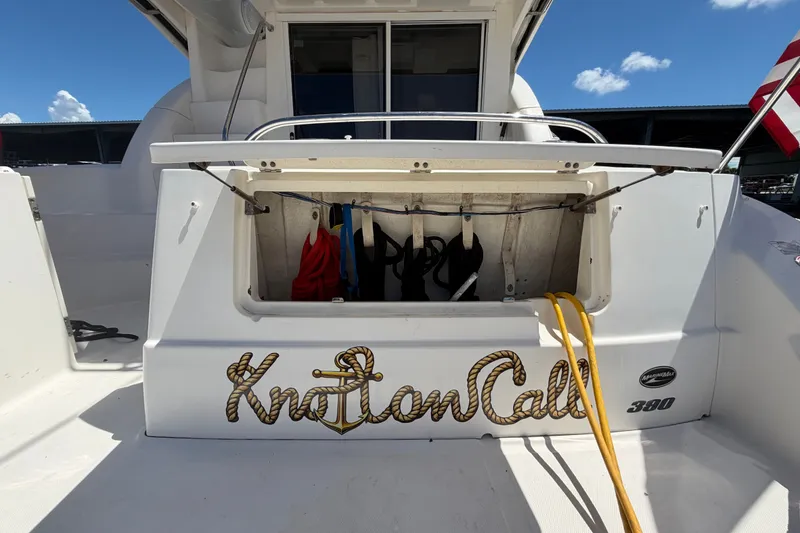 Slide: The Image of 2010 Sea Ray 390 Sedan Bridge boat stern with storage compartment open. - 20