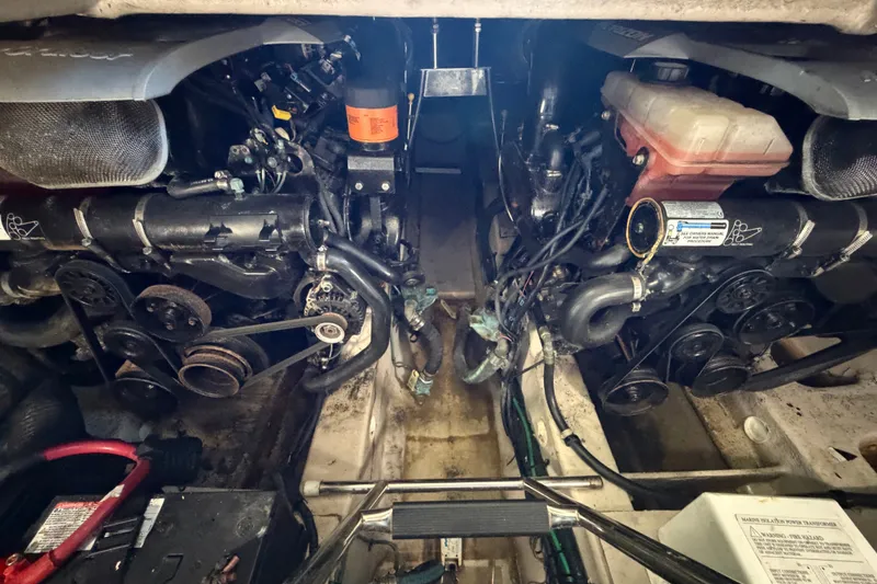 Slide: The Image of Engine compartment of a 2010 Sea Ray 390 Sedan Bridge, showcasing mechanical components. - 134