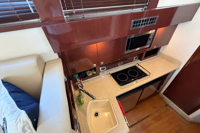 Slide: The Image of Luxurious kitchen area in 2010 Sea Ray 390 Sedan Bridge yacht. - 60