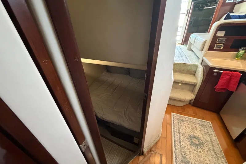 Slide: The Image of Interior of 2010 Sea Ray 390 Sedan Bridge, featuring cozy cabin and compact living space. - 123