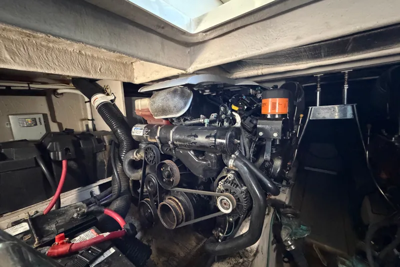 Slide: The Image of Engine compartment of a 2010 Sea Ray 390 Sedan Bridge, showcasing mechanical components. - 136
