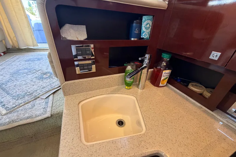 Slide: The Image of Interior of 2010 Sea Ray 390 Sedan Bridge with sink and countertop amenities. - 78