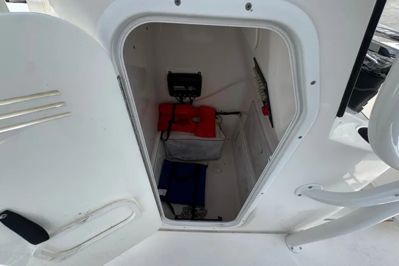 Slide: The Image of Open storage compartment in 2019 Blue Wave 2800 Pure Hybrid boat. - 48