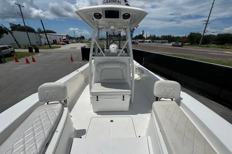 Slide: The Image of 2019 Blue Wave 2800 Pure Hybrid boat interior with white seating and Garmin equipment. - 41