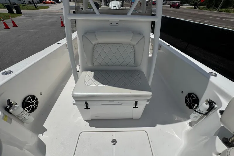 Slide: The Image of 2019 Blue Wave 2800 Pure Hybrid boat interior with cushioned seating and speakers. - 42