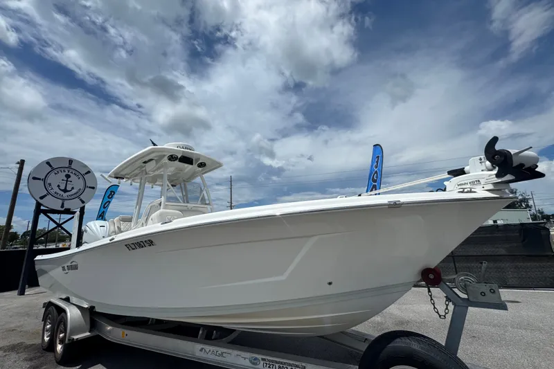 The Image of 2019 Blue Wave 2800 Pure Hybrid boat on trailer under cloudy sky. - 0
