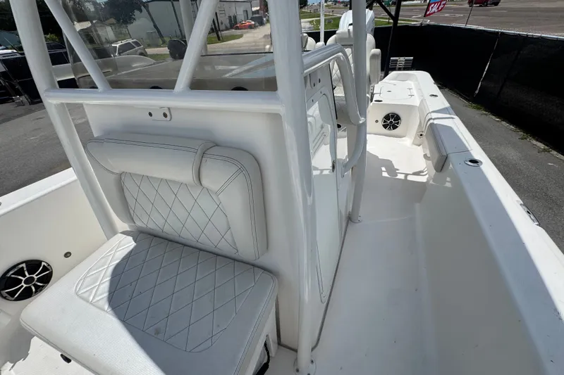 Slide: The Image of 2019 Blue Wave 2800 Pure Hybrid boat interior with white seating and console. - 45