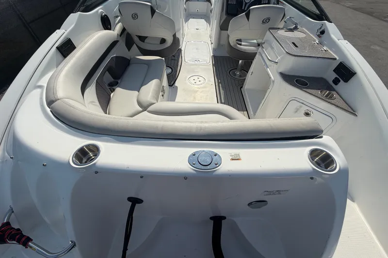 Slide: The Image of 2019 Hurricane SunDeck 2400 OB interior with seating and console features. - 12