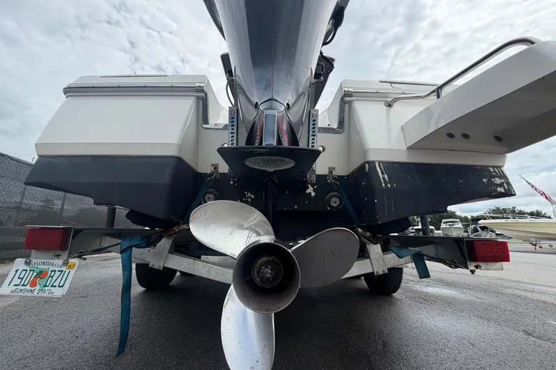 Slide: The Image of Rear view of 2019 Robalo 226 Cayman boat on trailer, showing propeller and license plate. - 5