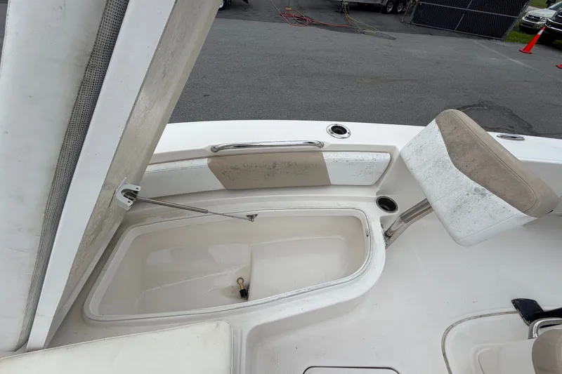Slide: The Image of 2019 Robalo 226 Cayman boat interior with open storage compartment and seating. - 42