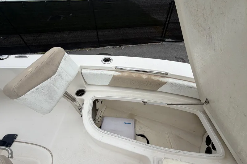 Slide: The Image of 2019 Robalo 226 Cayman boat storage compartment with open hatch and seat. - 37