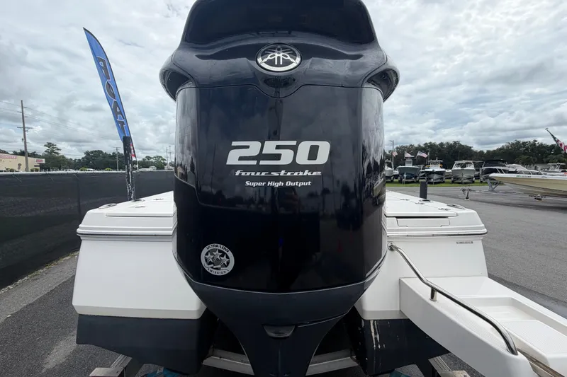 Slide: The Image of 2019 Robalo 226 Cayman boat with 250 horsepower four-stroke engine, displayed outdoors. - 4