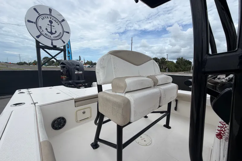 Slide: The Image of 2019 Robalo 226 Cayman boat interior with seating and outboard motor. - 59