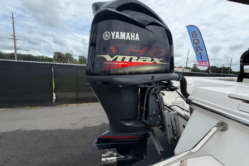 Slide: The Image of 2019 Robalo 226 Cayman with Yamaha VMAX outboard engine, displayed outdoors. - 3