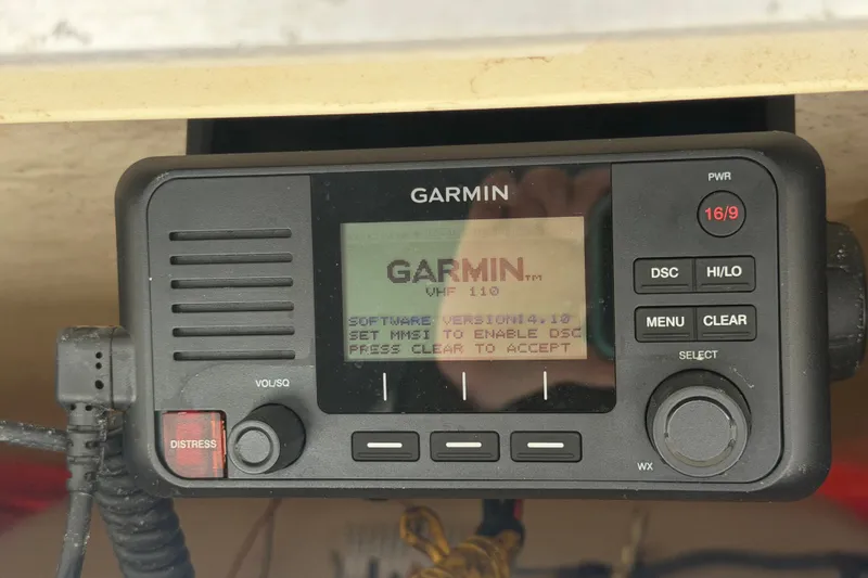 Slide: The Image of Garmin VHF 110 radio on 2019 Robalo R222 Center Console boat. - 20