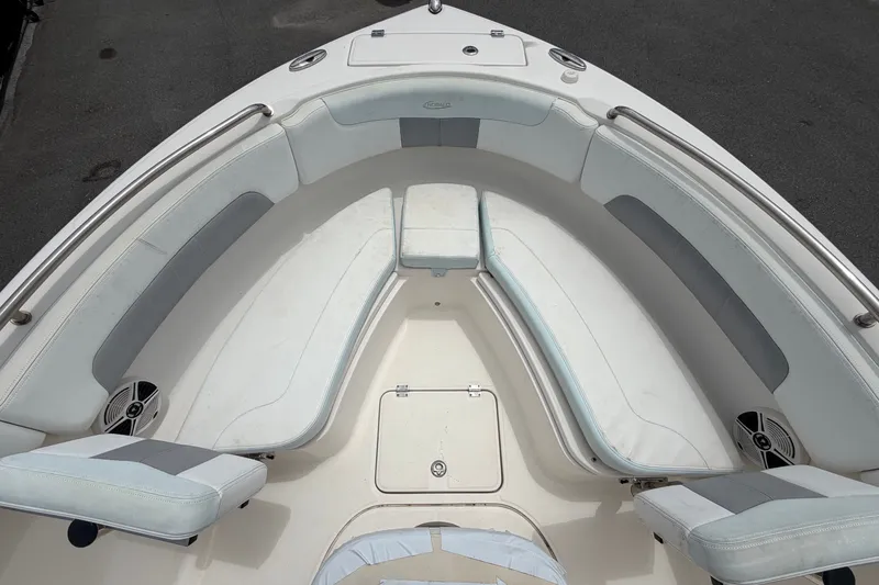 Slide: The Image of The image shows the deck of a 2019 Robalo R222 Center Console boat with seating. - 32