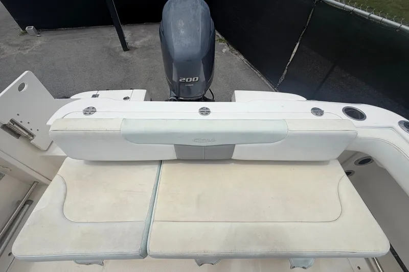 Slide: The Image of 2019 Robalo R222 Center Console boat with Yamaha 200 engine, featuring cushioned seating. - 66