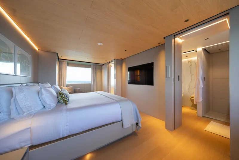 Slide: The Image of Luxurious bedroom interior on 2023 Cantiere Delle Marche RJ 115 yacht, featuring modern design and ensuite bathroom. - 27