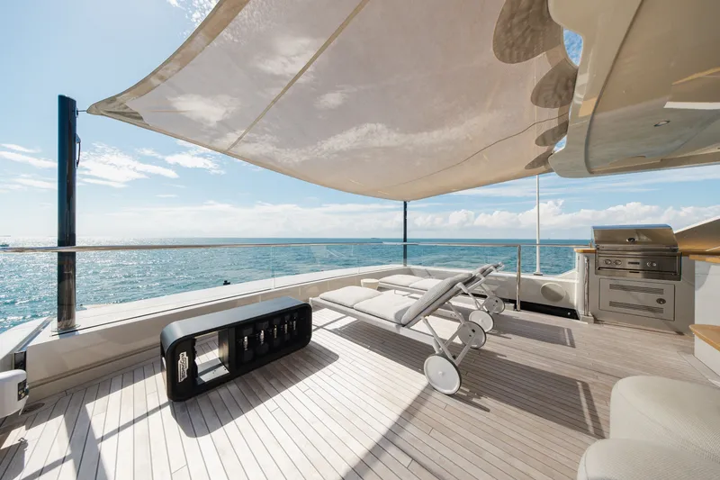 Slide: The Image of Luxurious 2023 Cantiere Delle Marche RJ 115 yacht deck with sun loungers and ocean view. - 64