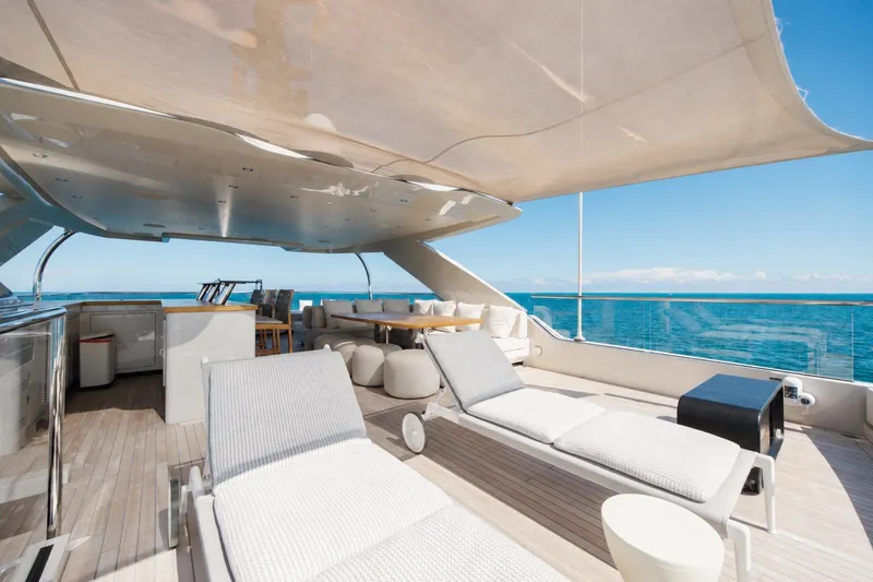 Slide: The Image of Luxurious 2023 Cantiere Delle Marche RJ 115 yacht deck with lounge chairs and ocean view. - 66