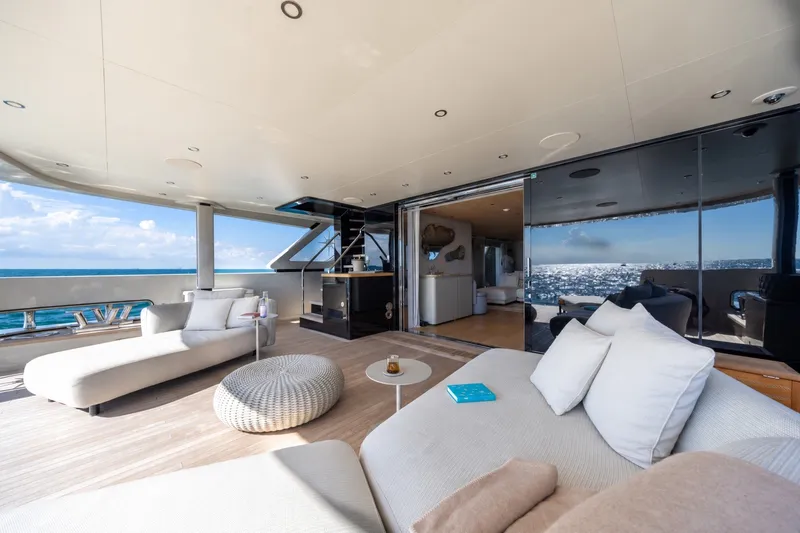 Slide: The Image of Luxurious 2023 Cantiere Delle Marche RJ 115 yacht deck with modern seating and ocean view. - 15