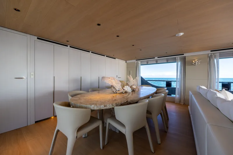 Slide: The Image of Luxurious dining area on 2023 Cantiere Delle Marche RJ 115 yacht with ocean view. - 22