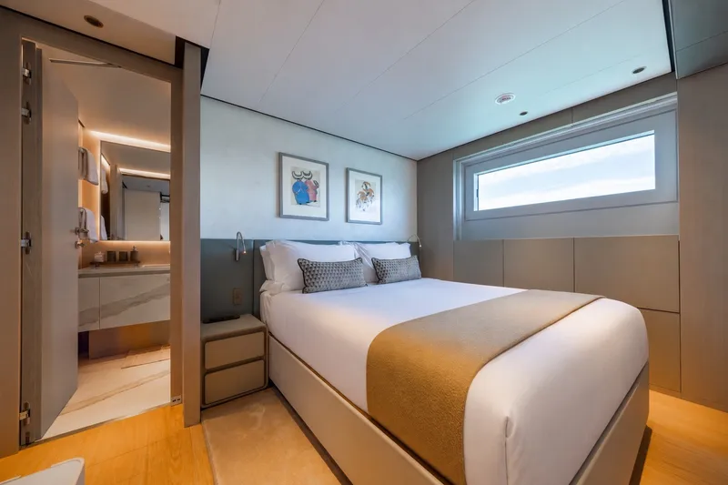 Slide: The Image of Luxurious bedroom interior on 2023 Cantiere Delle Marche RJ 115 yacht, featuring modern design and elegant decor. - 33