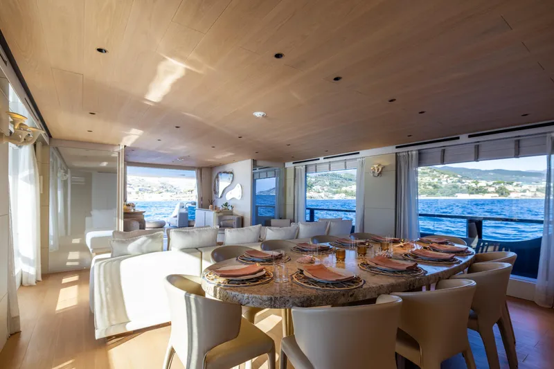 Slide: The Image of Luxurious interior of 2023 Cantiere Delle Marche RJ 115 yacht with elegant dining area and sea view. - 16