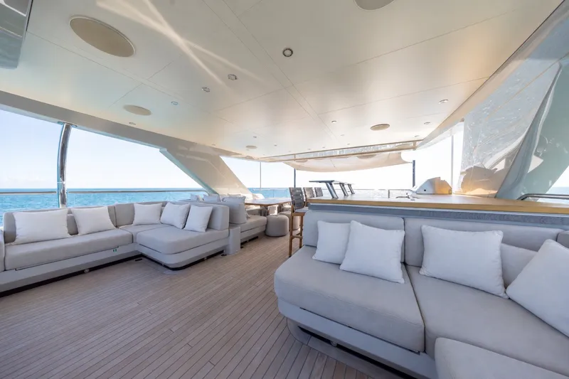 Slide: The Image of Luxurious 2023 Cantiere Delle Marche RJ 115 yacht interior with elegant seating and ocean view. - 69