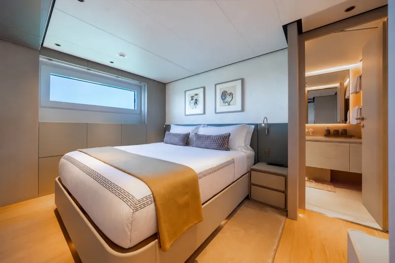 Slide: The Image of Luxurious bedroom interior on 2023 Cantiere Delle Marche RJ 115 yacht, featuring modern design and ensuite bathroom. - 36