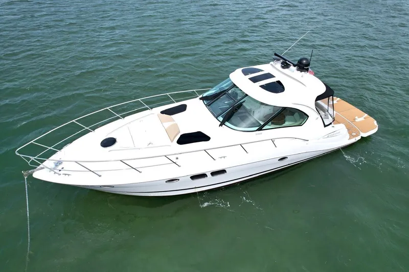 Slide: The Image of 2009 Four Winns V458 yacht on calm water, aerial view. - 10