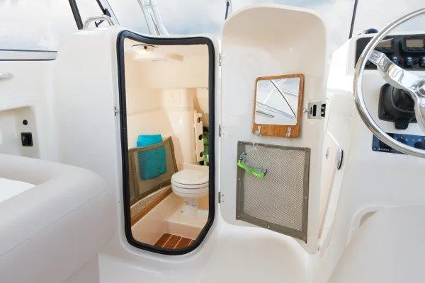 Slide: The Image of Manufacturer Provided Image: 2014 Grady-White Freedom 275 boat interior with a compact bathroom. - 9