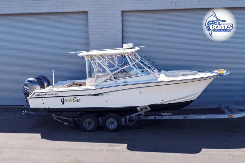 Slide: The Image of 2014 Grady-White Freedom 275 boat on trailer, side view, with dual Yamaha engines. - 0