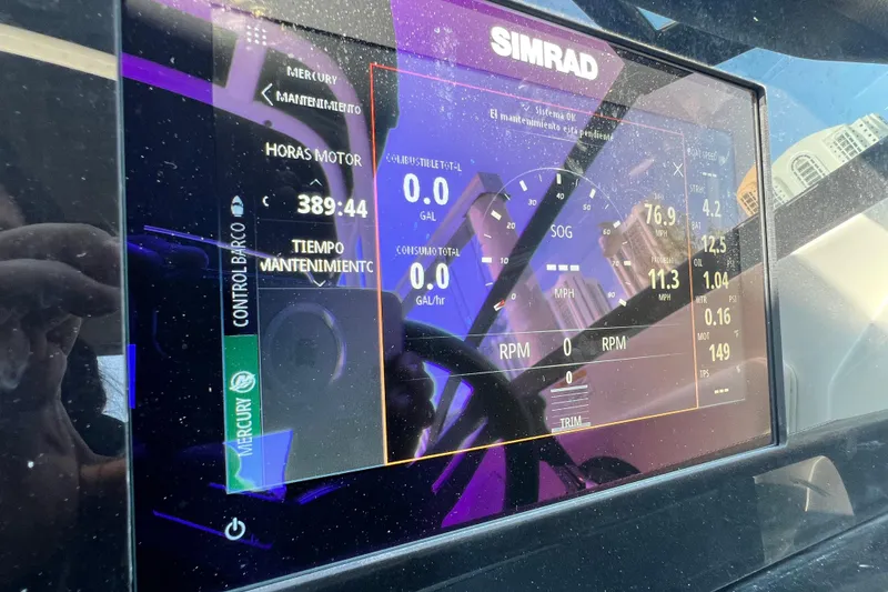 Slide: The Image of Simrad display on 2019 Sea Ray SDX 270 Outboard showing engine metrics and maintenance data. - 91