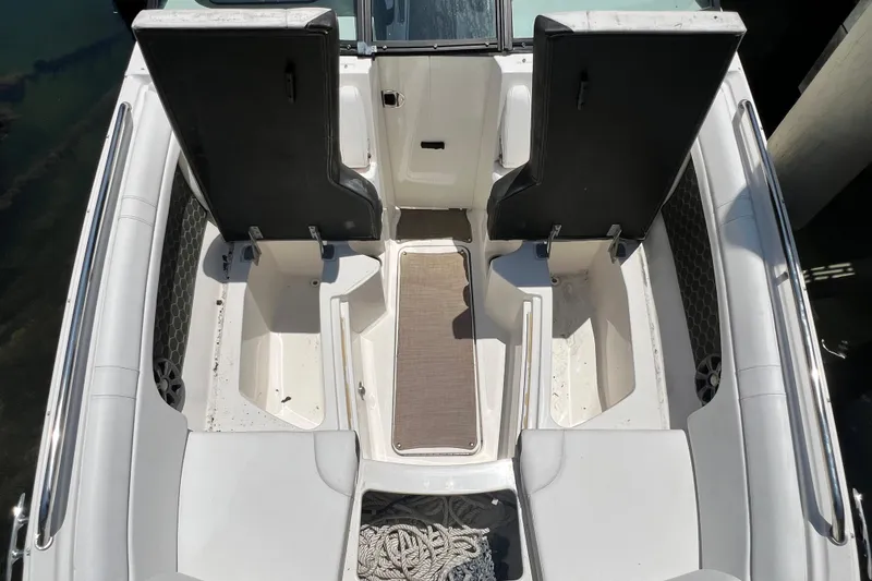 Slide: The Image of 2019 Sea Ray SDX 270 Outboard boat interior with seating and storage compartments. - 60