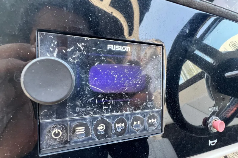 Slide: The Image of Fusion audio system on 2019 Sea Ray SDX 270 Outboard boat dashboard. - 92