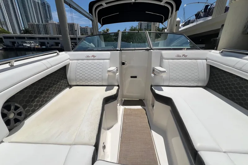 Slide: The Image of 2019 Sea Ray SDX 270 Outboard interior with white seating and modern design. - 56