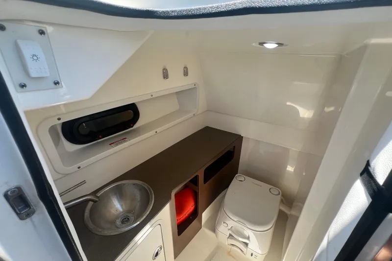 Slide: The Image of Interior of 2019 Sea Ray SDX 270 Outboard boat with sink and toilet. - 83
