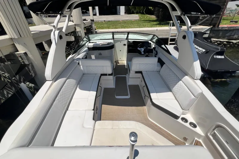 Slide: The Image of 2019 Sea Ray SDX 270 Outboard boat interior with spacious seating and modern design. - 73