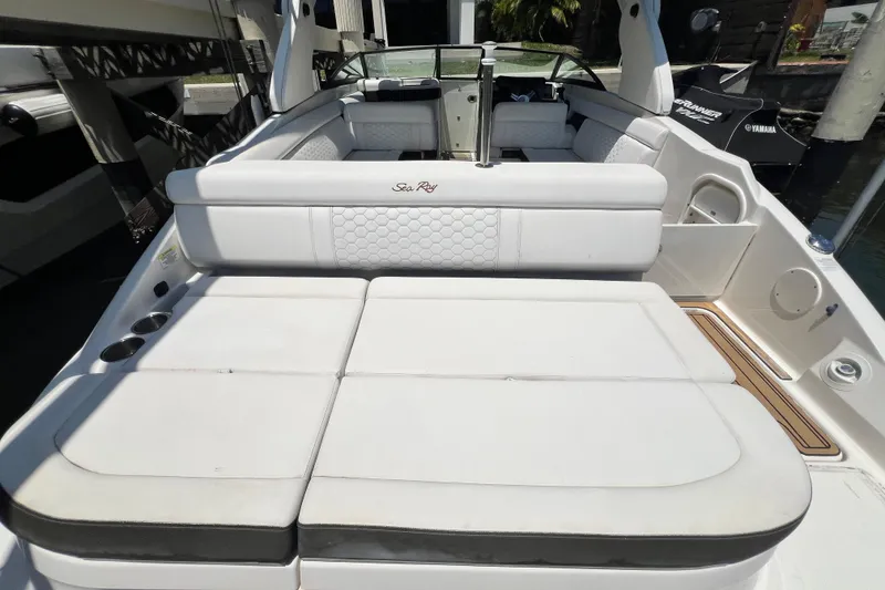 Slide: The Image of 2019 Sea Ray SDX 270 Outboard boat with spacious white seating and sleek design. - 74