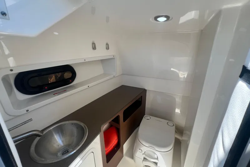 Slide: The Image of Interior of 2019 Sea Ray SDX 270 Outboard boat with sink and toilet. - 79