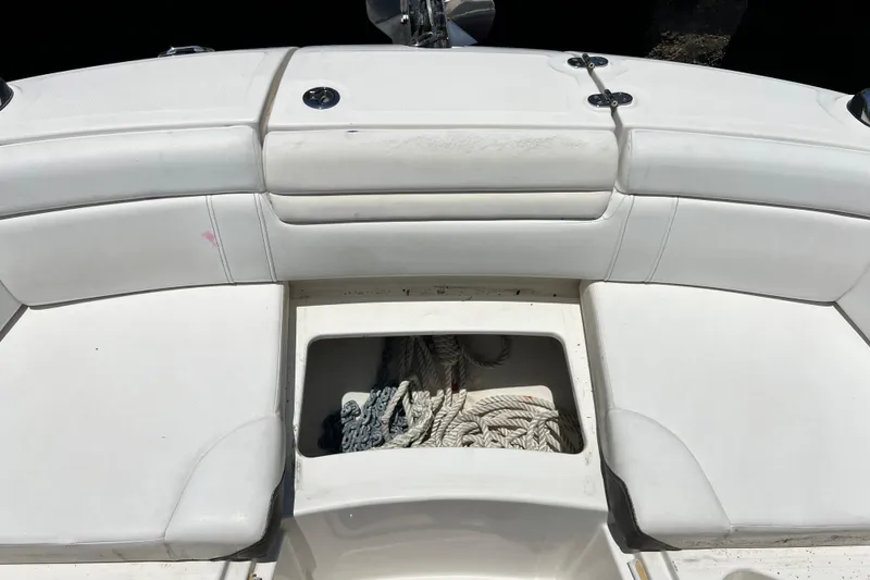 Slide: The Image of 2019 Sea Ray SDX 270 Outboard boat seating with storage compartment and ropes. - 64
