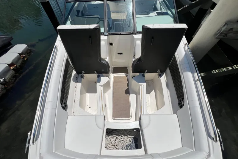 Slide: The Image of 2019 Sea Ray SDX 270 Outboard boat interior with open seating and storage compartments. - 61